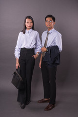 Asian business man and woman.Asian female and male model wearing office attire.