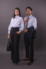 Asian business man and woman.Asian female and male model wearing office attire.