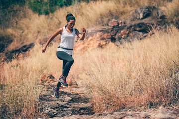 Strong Athlete Woman Trail Runners are Running for Training in the Mountains in Summer , Adventure Sport and Lifestyle Concept