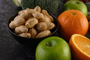 close up with peanut, Slice of fresh orange, apple, kiwi, and avocado.