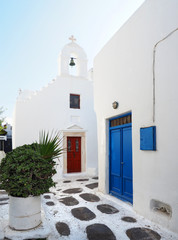 Typical Whitewashed Buildings with Colorful Doors and Accents of Mykonos, Greece