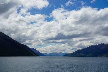 Lake, mountains, trees, sky, clouds in New Zealand
