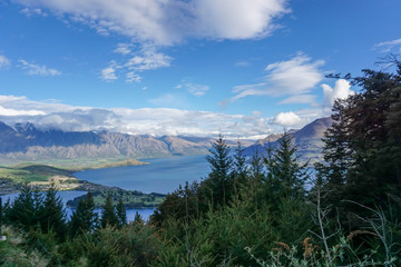 Lake, mountains, trees, sky, clouds in New Zealand