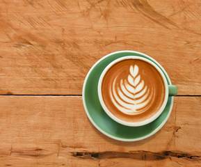 cup of coffee on wooden table