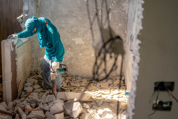 Men worker are extracting structure concrete floor. .Hard work.