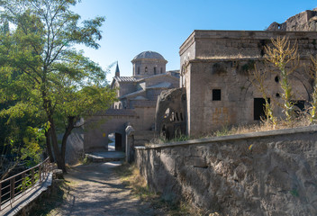 Fototapeta na wymiar View of St. Gregory's Church (Buyuk Kilise Camii Mosque) in Monastery Valley Or Manastir Vadisi, Guzelyurt, Aksaray Province, Cappadocia, Turkey