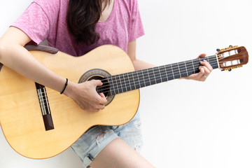 woman musician play acoustic guitar on white background.concept for live music
