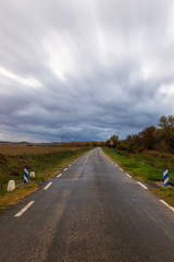 Asphalt road on a cloudy day by Soria