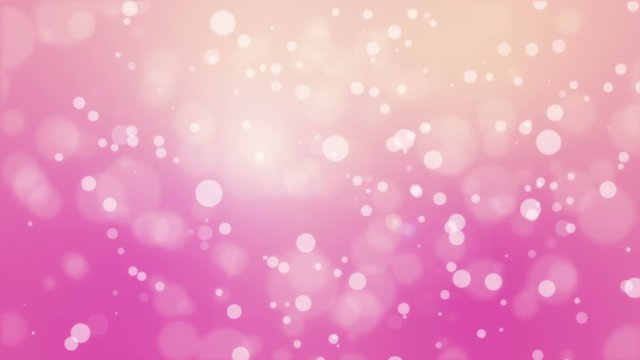 Animated pink yellow bokeh background with glowing light particles.