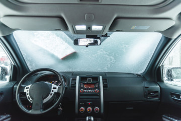 view from inside of car snow at windshield after blizzard