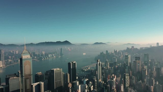 AERIAL. Top view of Hong Kong city panorama. Drone footages with skyscrapers at sunrise.