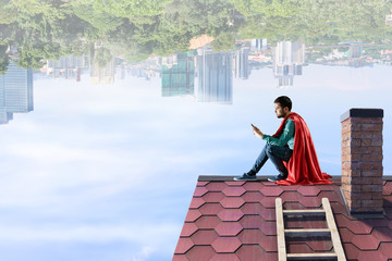 Super hero on roof. Mixed media
