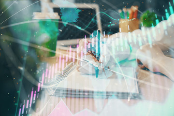 Forex chart displayed on woman's hand taking notes background. Concept of research. Double exposure