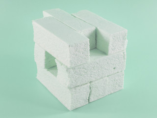 Sweet green marshmallow with mint flavor in the form of a geometric shape