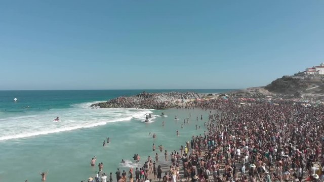 Drone shot, surf near the crowd. Saquarema Beach