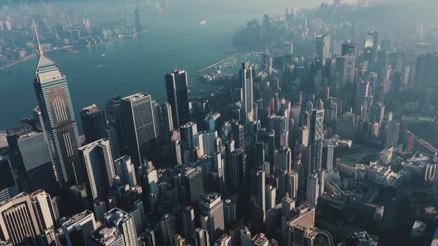 AERIAL. Top view of Hong Kong city panorama. Drone footages with skyscrapers at sunrise.