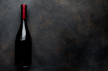 bottle of wine on a stone background with copy space for your text