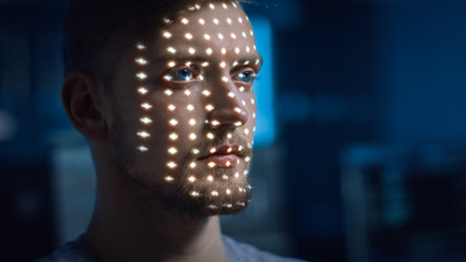 Handsome Young Caucasian Man is Identified by Biometric Facial Recognition Scanning Process....