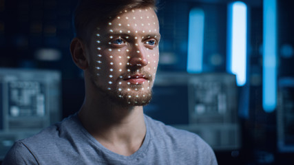 Handsome Young Caucasian Man is Identified by Biometric Facial Recognition Scanning Process....