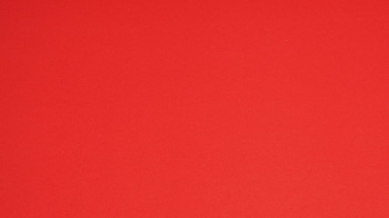 Red paper for background.it is empty space and no people.