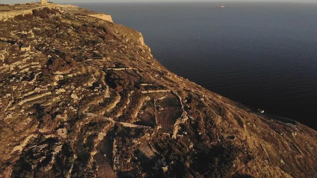 Dingli Cliff in Malta with her little sister Filfla