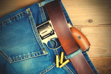 silver revolver nagant in the pocket