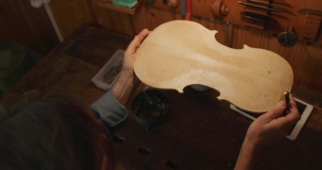 Female luthier at work in her workshop