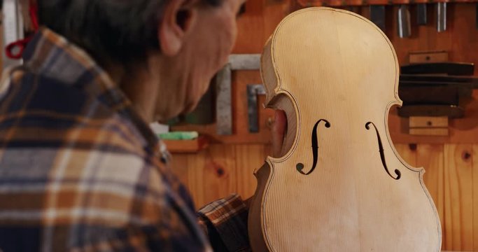 Female luthier at work in her workshop