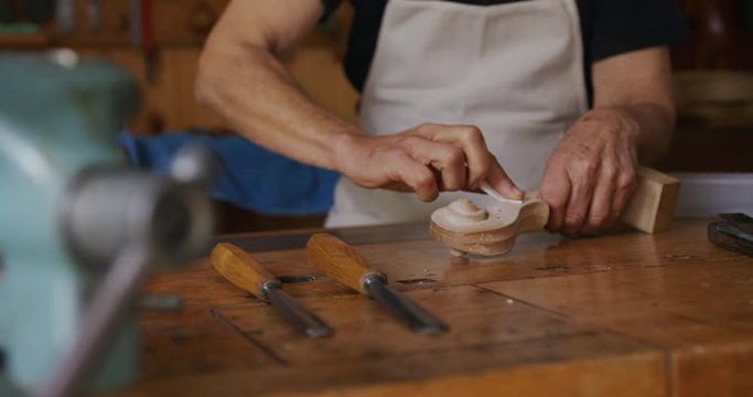 Female luthier at work in her workshop