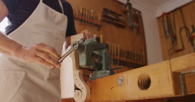 Female luthier at work in her workshop