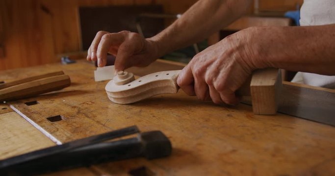 Female luthier at work in her workshop