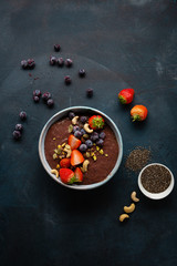 Berry and chocolate smoothie in bowl top view
