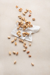 Fototapeta na wymiar Bunch of pistachio nut on white paper
