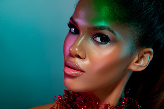 Fashionable Portrait girl in neon light background. color filter. Portrait of beautiful black woman. Makeup. Futuristic Abstract Blue and Green Neon Light Background. trendy color background - Image  