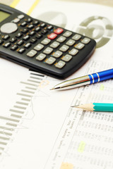 Business concept with a report and a calculator