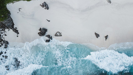 Aerial view of beautiful island at Seychelles in the Indian Ocean. Top view from drone. Spectacular aerial view of some yachts and small boats floating on a clear and turquoise sea, Seychelles in the 