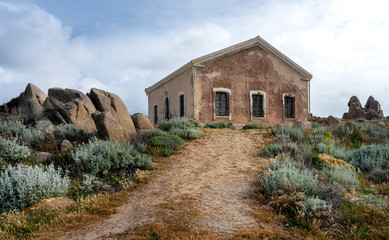 Small stone house in the mountains of Capo Testa on the island of Sardinia, Italy