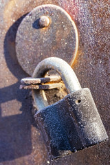 Old padlock covered with hoarfrost