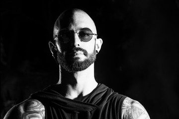 B/W male portrait at dark background