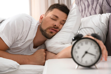 Handsome man sleeping at home in morning