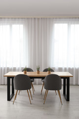 Modern room interior with chairs and table