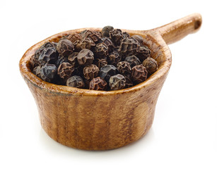 black pepper in wooden cup