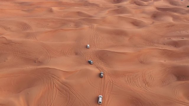 Desert safari car sand dunning in the Dubai desert during sunset
