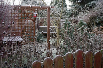 garden gazebo covered with the first light snow