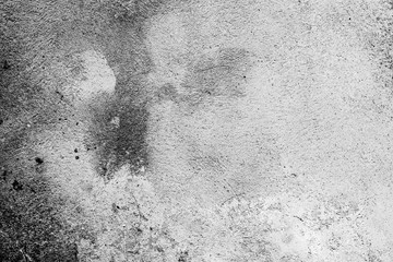 Texture of a concrete wall with cracks and scratches which can be used as a background