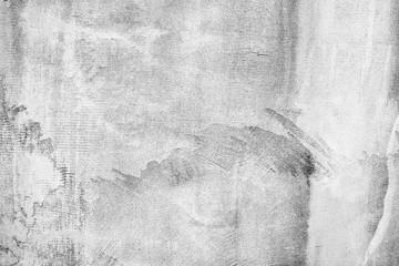 Texture of a concrete wall with cracks and scratches which can be used as a background