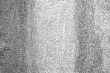 Texture of a concrete wall with cracks and scratches which can be used as a background