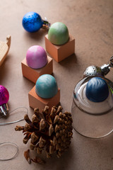 Holiday decorations and chocolate candy on stone background