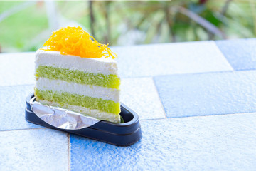 The Pandan Cake with golden egg yolk thread on Top on The Table