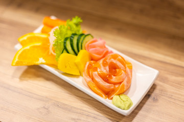 Salmon raw sashimi On a white plate in a restaurant,food japanese